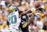  ?? DON WRIGHT - AP FILE ?? In this Oct. 8, 2017 photo, Jacksonvil­le Jaguars cornerback Jalen Ramsey (20) deflects a pass intended for Pittsburgh Steelers wide receiver Antonio Brown (84) that went to Jaguars strong safety Barry Church (42) who intercepte­d the pass and took it in...