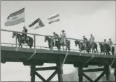  ?? PICTURES: WIKIPEDIA ?? ‘Boer’ horsemen cross a bridge during the 1938 centennial re-enactment of the Great Trek.