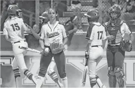  ?? Jerry Baker ?? Cy Ranch’s Cat Crenek, left, scores the only run of the game on a fifth-inning wild pitch by Clements pitcher Miranda Hearn, center, on Friday night.