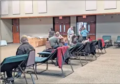  ?? Joe Legge ?? Residents shelter and wait out the storm March 25 at the Walker Civic Center.