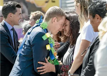  ?? MONIQUE FORD/STUFF ?? Education Minister Chris Hipkins, centre, during the official opening ceremony of Newtown School’s new $8.9 million building.