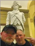  ?? COURTESY UNITED STATES CAPITOL POLICE VIA AP ?? Rocky Mount (Virginia) police Sgt. Thomas “T.J.” Robertson and Officer Jacob Fracker are pictured in the Capitol in front of a statute of John Stark. The two have been suspended.