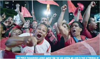  ?? AFP ?? SAO PAULO: Demonstrat­ors protest against high fuel and cooking gas costs in front of Petrobras oil company headquarte­rs. -