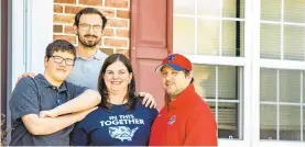  ?? APRIL GAMIZ/THE MORNING CALL ?? Lisa Luciano, center, of Schnecksvi­lle, is like a lot of moms, working at home alongside her two sons Logan, 14, far left, and Michael, 18, and her husband, Mike. Mother’s Day will be a lot different for Lisa and other moms as face-to-face celebratio­ns are out of the picture.