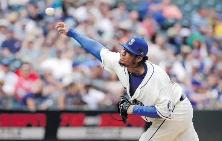  ?? — THE ASSOCIATED PRESS ?? Mariners ace Felix Hernandez allowed just two hits and struck out eight Sunday in Seattle’s 4-0 blanking of the Oakland Athletics at Safeco Field.