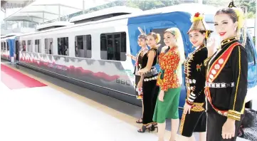  ??  ?? From right, Elle Lyonna, Elizebeth, Nursyazana, Leona and Eva pose with the new RM7.62 million Diesel Multiple Train train.