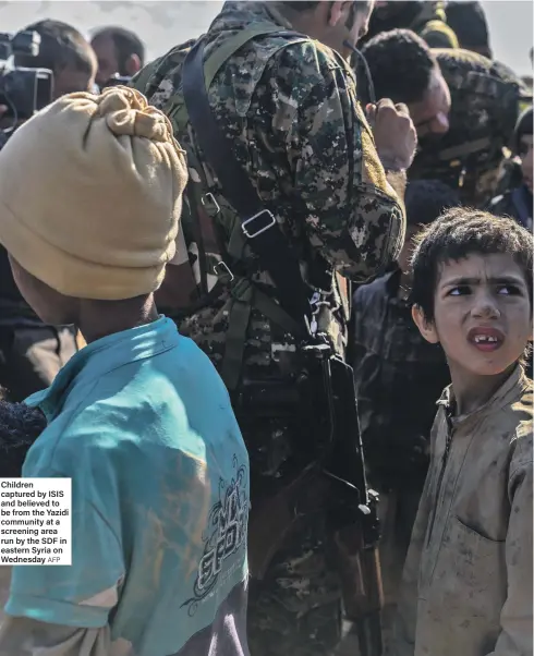  ?? AFP ?? Children captured by ISIS and believed to be from the Yazidi community at a screening area run by the SDF in eastern Syria on Wednesday