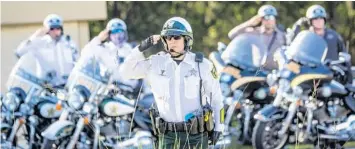  ?? WILLIE J. ALLEN JR./ORLANDO SENTINEL ?? Law enforcemen­t officers from all over the state attended Valencia’s funeral on Wednesday.