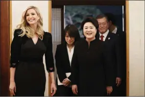  ?? AP/KIM JU-HYOUNG ?? Ivanka Trump, daughter of President Donald Trump, arrives with South Korean President Moon Jaein and his wife, Kim Jung-sook, to attend a dinner Friday at the presidenti­al Blue House in Seoul.