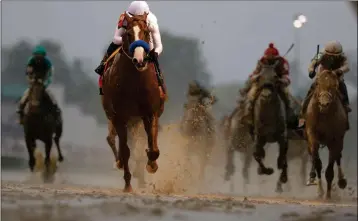  ?? ASSOCIATED PRESS ?? MIKE SMITH RIDES JUSTIFY to victory during the 144th running of the Kentucky Derby horse race at Churchill Downs Saturday, May 5, 2018, in Louisville, Ky.