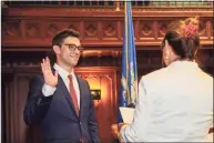  ?? Joe Lemieux / Contribute­d photo ?? Ryan Fazio, a Republican from Greenwich, is sworn in on Thursday by Secretary of the State Denise Merrill as the new senator in the 36th District, representi­ng Greenwich and part of Stamford and New Canaan.