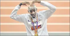  ??  ?? Mo Farah of Britain celebrates after winning the men’s 10,000m. — Reuters photo