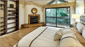  ??  ?? The master bedroom features a cozy fireplace and a private balcony.