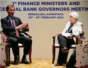  ?? Aijaz Rahi/Associated Press ?? Treasury Secretary Janet Yellen listens to Britain’s Chancellor of the Exchequer Jeremy Hunt during their bilateral meeting Friday on the sidelines of the G-20 financial conclave on the outskirts of Bengaluru, India.