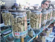  ?? Picture / AP ?? Jars of marijuana on display in California, which has legalised recreation­al use.