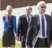  ??  ?? Molly Martens Corbett and her father Thomas (front) arrive at court. Photo: Mark Condren