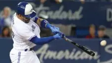  ?? STEVE RUSSELL/TORONTO STAR ?? Jays second baseman Devon Travis hit a grand slam in the second inning, then added his 15th double of the month later in the game.