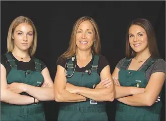  ?? Canadian Press photo ?? Dr. Michelle Oakley, centre, poses for a photo flanked by her two oldest daughters Maya, left, and Sierra in an undated handout photo from National Geographic Wild.