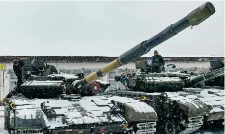  ?? ?? Tanks of the 92nd Separate Mechanized Brigade of the Ukrainian Armed Forces prepare to take part in a drill near Klugino-Bashkirivk­a village, not far from the Eastern Ukrainian city of Kharkiv, on January 31, amid escalation on the Ukraine-Russia border