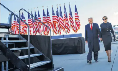  ?? REUTERS ?? Now former U.S. president Donald Trump walks next to his wife Melania Trump as they depart Washington hours before President Joe Biden was inaugurate­d on Wednesday.