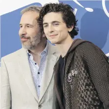  ?? THE ASSOCIATED PRESS ?? Director Denis Villeneuve, left, and star Timothée Chalamet at the Venice Film Festival, where Dune is debuting outside of the competitio­n slate, on Friday.