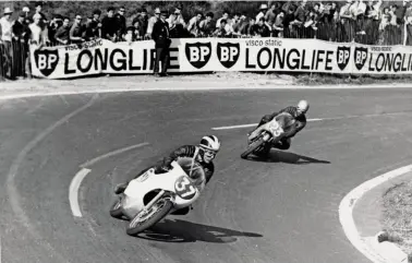  ??  ?? Above: 1964 French GP No. 37 Phil Read leads No. 23 Jim Redman.Below: Jim Redman (left) and Phil Read (right) at the 1964 Junior TT.