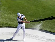  ??  ?? Jordan Spieth of the US plays out of a bunker on the 14th hole during a practice round for the Ryder Cup at Le Golf National in Saint-Quentin-en-Yvelines, outside Paris, France, on Wednesday.AP PhoTo/AlASTAIr GrAnT