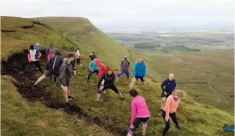  ??  ?? Stretching at the top of the mountain.