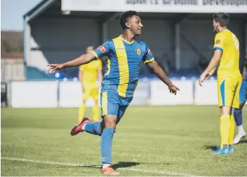  ??  ?? Dion Sembie-Ferris after scoring for Peterborou­gh Sports against Concord Rangers. Photo: James Richardson.