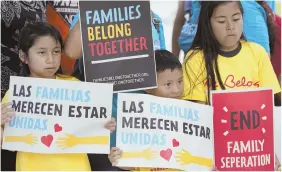  ?? AP FILE PHOTOS ?? VICTIMS: Migrant children demonstrat­ed recently in Florida against the policy of U.S. Border Patrol agents, right, separating children from their families.