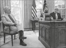  ?? ASSOCIATED PRESS ?? SENATE MAJORITY LEADER Mitch McConnell of Ky., listens as President Donald Trump speaks during a meeting in the Oval Office of the White House in Washington on Monday.