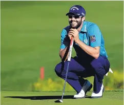 ?? CHRIS CARLSON/ASSOCIATED PRESS ?? Adam Hadwin smiles on the 18th green on his way to shooting a 59 in the third round of the CareerBuil­der Challenge on Saturday.