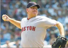  ?? Bill Kostroun / Associated Press ?? Red Sox pitcher Curt Schilling delivers against the Yankees in an August 2007 game.