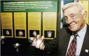  ?? ASSOCIATED PRESS FILE PHOTO ?? Baseball Hall of Famer Phil Niekro holds a knucklebal­l at the Great Lakes Science Center in Cleveland in 2007. The knucklebal­ler, who 318 games, has died at the age of 81.