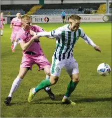  ??  ?? Wexford’s Karl Manahan (from Greystones) holds onto Luka Lovic of Bray Wanderers at the Carlisle Grounds last weekend.