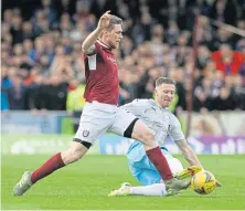  ?? ?? Lichties legend Bobby Linn after his penalty miss, top; Colin Hamilton goes past Shane Sutherland.