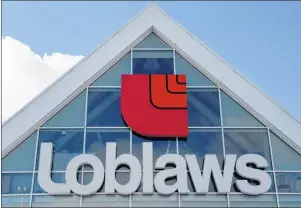  ?? CP PHOTO/RYAN REMIORZ ?? A Loblaws store is seen March 9, 2015, in Montreal. Loblaw Companies Ltd. says minimum wage increases in Ontario and Alberta and health care reform in Quebec are expected to hurt its bottom line.