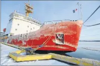  ?? BRIAN MCINNIS/THE GUARDIAN ?? The Canadian Coast Guard Ship Henry Larsen is moored at the former coast guard wharf in Charlottet­own Wednesday after the ship cut a path through the ice in the Charlottet­own harbour so the Irving Oil tanker Acadian could make it to the wharf to...