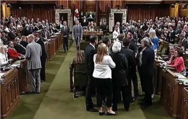  ?? HOUSE OF COMMONS/THE CANADIAN PRESS ?? Prime Minister Justin Trudeau and several MPs get physical on the floor of the House of Commons in Ottawa on May 18.
