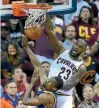  ?? USA TODAY SPORTS ?? Cleveland Cavaliers forward LeBron James dunks the ball against Golden State Warriors forward Harrison Barnes in game four of the NBA Finals yesterday.