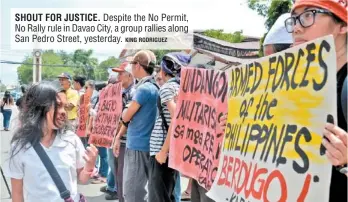  ?? KING RODRIGUEZ ?? SHOUT FOR JUSTICE. Despite the No Permit, No Rally rule in Davao City, a group rallies along San Pedro Street, yesterday.