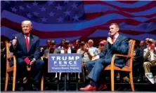  ?? AP PHOTO/ EVAN VUCCI ?? Then-presidenti­al candidate Donald Trump gives a thumbs up as he speaks with retired Lt. Gen. Michael Flynn during a 2016 town hall in Virginia Beach, Va. Trump announced Wednesday on Twitter he would be pardoning Flynn, calling it his “Great Honor.”