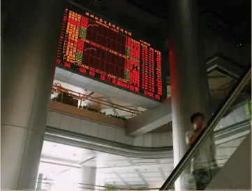  ??  ?? A PANEL displays share prices at the Shenzen Stock Exchange in China.