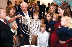  ?? (Matty Stern/US Embassy Jerusalem) ?? US AMBASSADOR to Israel, David M. Friedman, and his wife, Tammy, hosted Michal, widow of Halamish terror attack victim Elad Salomon and her children, at a candle lighting ceremony for the 3rd night of Hanukkah.