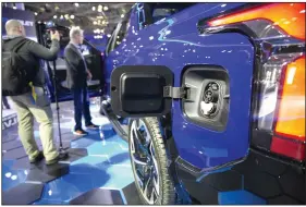  ?? York Internatio­nal Auto Show in New York City.
(AP) ?? The charging port on a Chevrolet 2024 Silverado full-size electric pickup is visible at the 2022 New