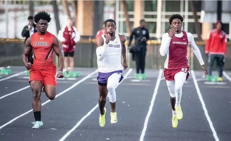  ?? (Photo courtesy of El Dorado News-Times) ?? Arkansas High’s Telly Wells, right, runs during an event Wednesday during the Oil Belt Relays in El Dorado, Ark. Wells took second in the 200-meter dash with a blazing time of 22.44, which qualifies him for the state meet.