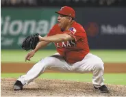  ?? Ronald Martinez / Getty Images ?? Bartolo Colon, 45, shows off his reflexes as he stabs a Dee Gordon line drive to end the seventh inning.