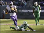  ?? AP PHOTO/HOWARD SIMMONS ?? Minnesota Vikings running back Latavius Murray (25) runs away from New York Jets’ Jamal Adams (33) and Tarell Basham (93) for a touchdown during the second half of an NFL football game Sunday, Oct. 21, 2018, in East Rutherford, N.J.