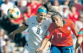  ?? Srdjan Suki EPA/Shuttersto­ck ?? JULIE ERTZ, at left batting Chile’s Javiera Toro, scored her first career World Cup goal Sunday in helping the United States secure a knockout stage berth.