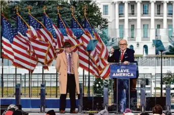  ?? Jacquelyn Martin/Associated Press 2021 ?? Lawyer John Eastman (left) joins former New York City Mayor Rudolph Giuliani at a rally for former President Donald Trump before the insurrecti­on at the U.S. Capitol on Jan. 6, 2021.